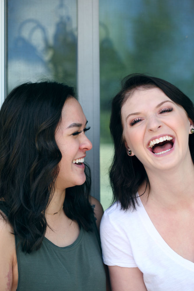 two girls laughing