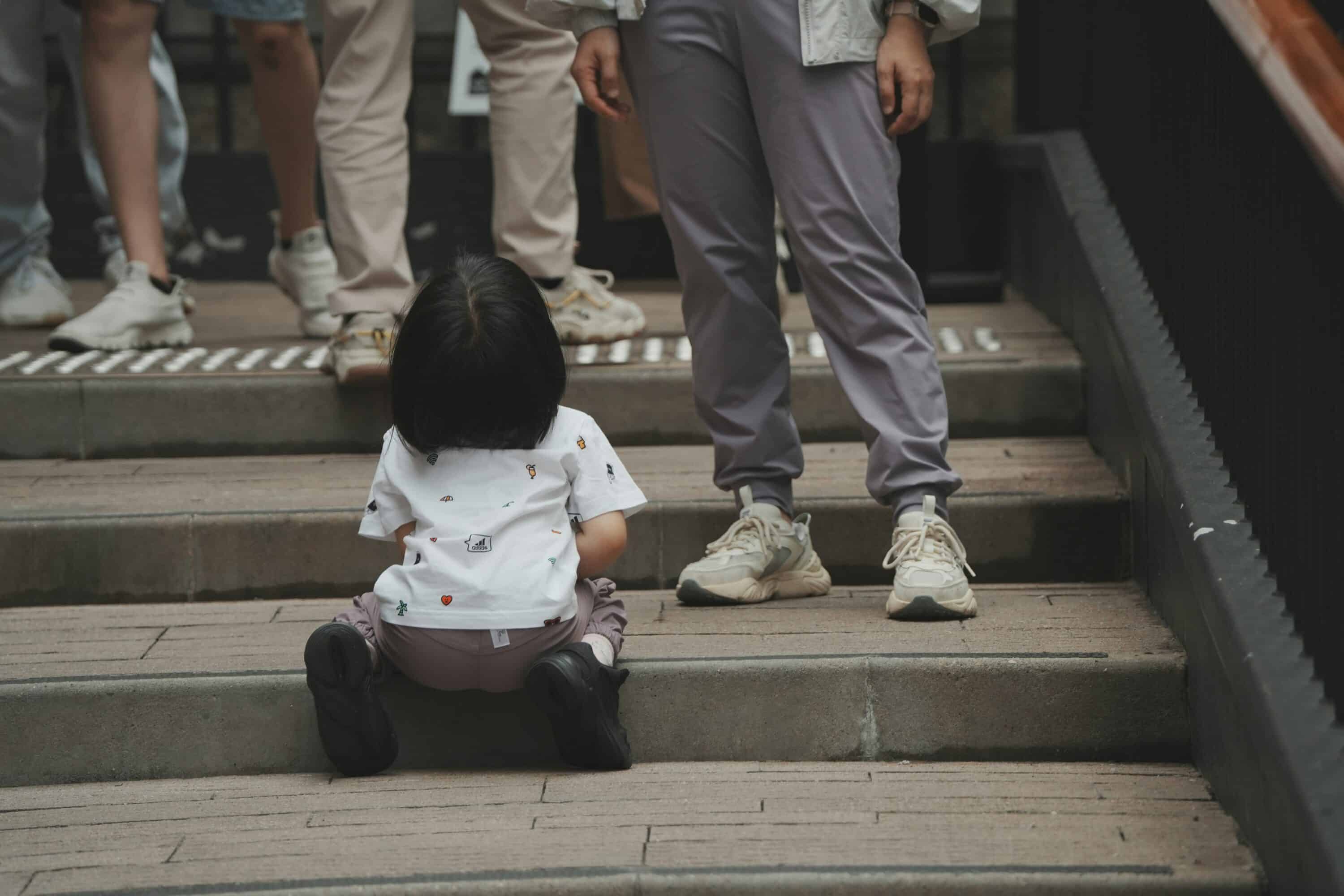Child waiting for father to appease them